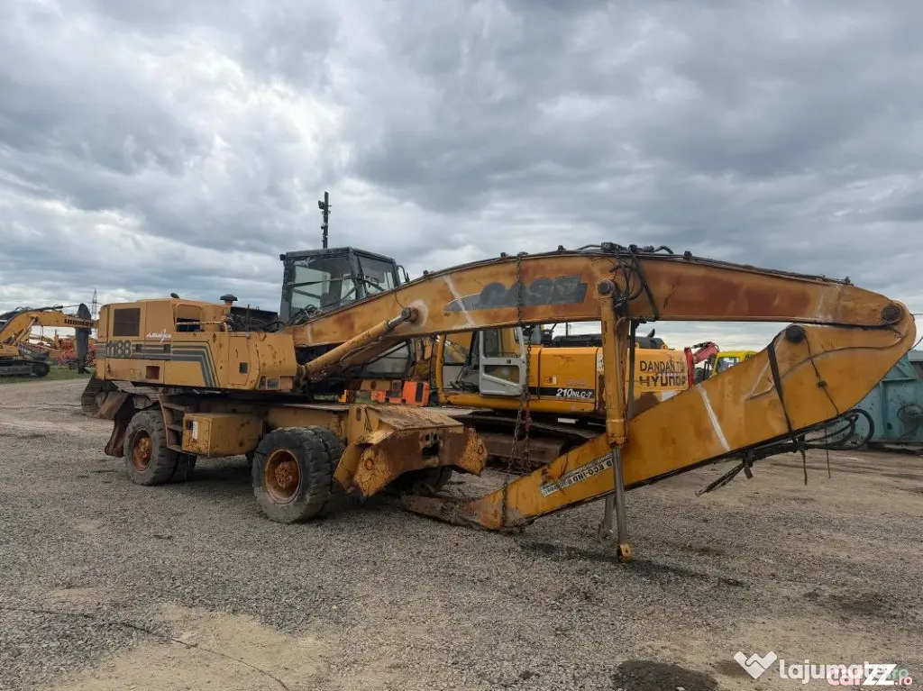 Dezmembrez excavator pe roti Case 1188