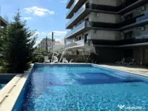 Apartament modern cu balcon generos și acces la piscină