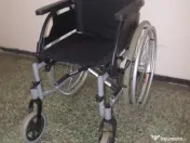 Scaun cu rotile pliabil carut dizabilitati,cu suporturi pt. asezat talpi picioare