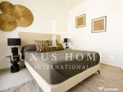 Apartament la parter, cu terasă și piscină comunitară situată aproape de coastă 