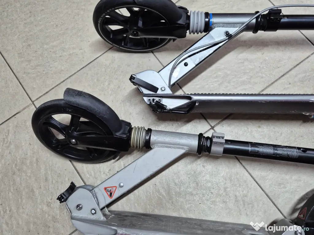 2 trotinete Oxelo, adulți/copii, roți 200 mm, suspensii, 350 lei împreună