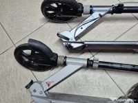 2 trotinete Oxelo, adulți/copii, roți 200 mm, suspensii, 350 lei împreună