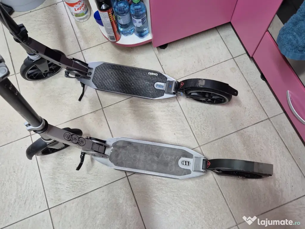 2 trotinete Oxelo, adulți/copii, roți 200 mm, suspensii, 350 lei împreună
