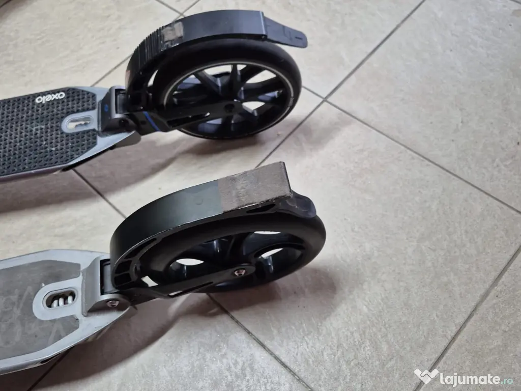 2 trotinete Oxelo, adulți/copii, roți 200 mm, suspensii, 350 lei împreună
