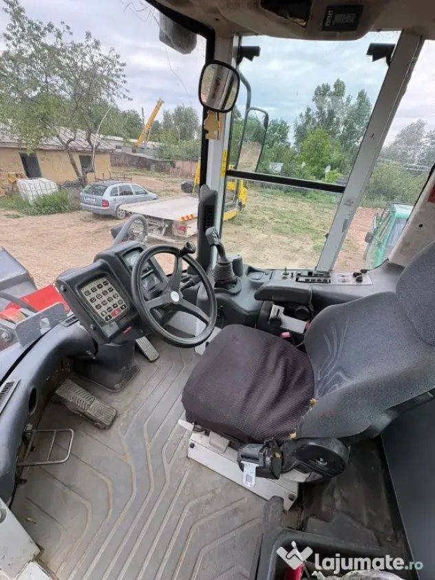 Vindem wolă Q&K, an 2003, 15 tone, 4x4 funcțională și pregătită pentru lucru.