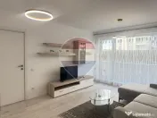 Inchiriere Apartament cu 2 camere, grădină de 62 mp și parcare 