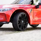 Masinuta electrica Bmw M4 2x45W 12V 7Ah cu roti moi scaun tapitat, culoare rosie