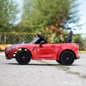 Masinuta electrica Bmw M4 2x45W 12V 7Ah cu roti moi scaun tapitat, culoare rosie