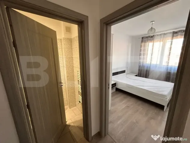 Apartament cu 3 camere, 55 mp, 2 bai, cu balcon si parcare,