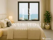 Apartament cu acces la plajă și piscină situată într-o zonă de coastă vibrantă 