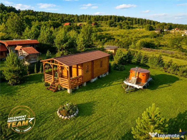 Casuta din lemn,cu 520mp teren intravilan,zona linistita,apr