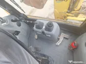 Buldoexcavator Komatsu 93S5, an 2007, cupa multifuncționala, anvelope noi