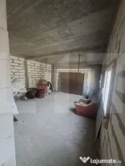 Casă P+M la roșu, teren 582 mp, garaj dublu, două intrăr