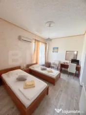 Cladire multifunctionala, pensiune plus casa, parcari priva 