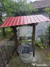 Casa de lemn pe un teren intravilan generos 