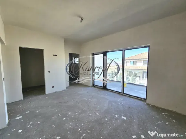 Locuinta moderna cu design cubic si curte plana in Dezmir