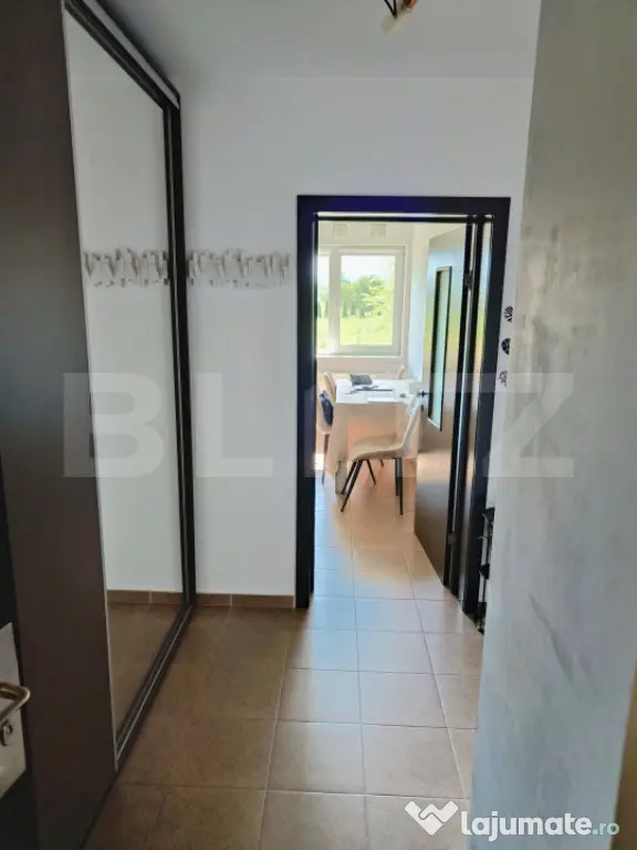 Garsonieră cochetă cu terasă generoasă și loc de parcar