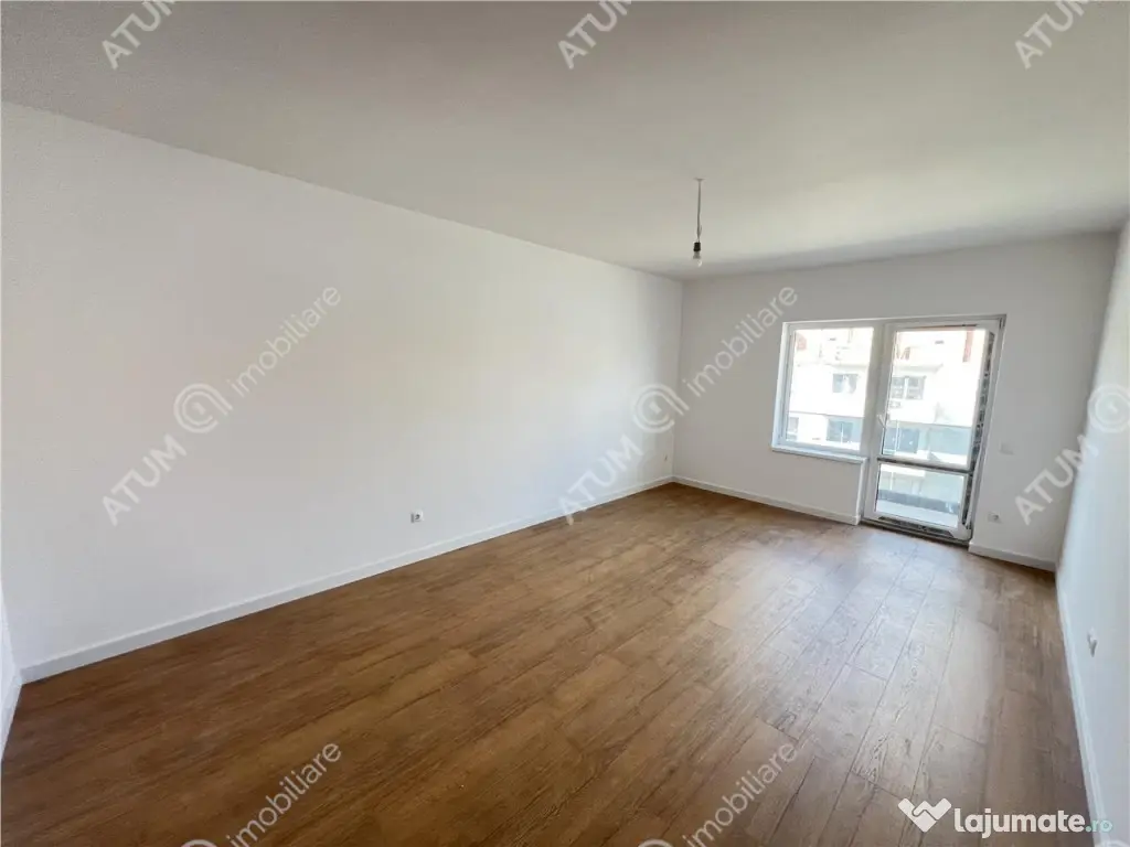 Apartament 2 camere balcon gradina si loc parcare zona Doamn