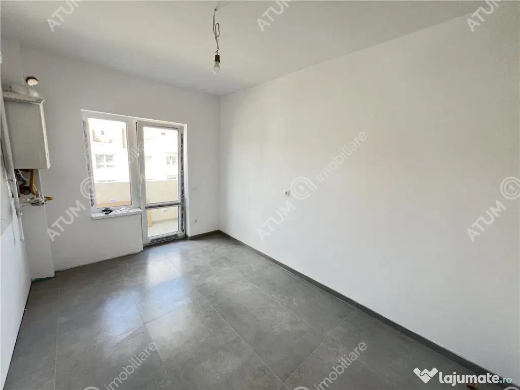 Apartament 2 camere balcon gradina si loc parcare zona Doamn