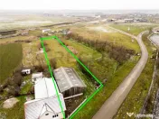 RECO . Teren intravilan cu hala metalica in Roit . 