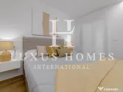 Apartament modern cu piscină comunitară și terasă, situat aproape de plajă 