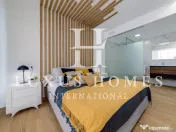 Apartament modern cu piscină comunitară și terasă, situat aproape de plajă 