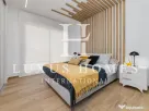 Apartament modern cu piscină comunitară și terasă, situat aproape de plajă