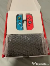 Titlu: Nintendo Switch OLED – Pachet Complet (Cutie Originală) 