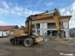 Dezmembrez excavator pe roti Liebherr 902