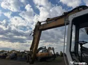 Dezmembrez excavator pe roti Liebherr 902 