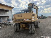 Dezmembrez excavator pe roti Liebherr 902 
