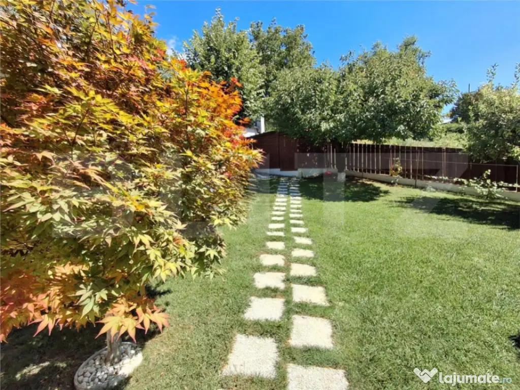 Proprietate elegantă cu teren mare și garaj în Bucium, pe