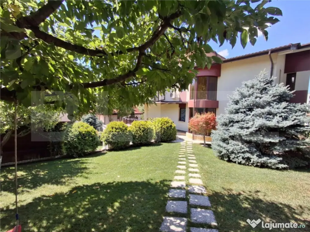 Proprietate elegantă cu teren mare și garaj în Bucium, pe