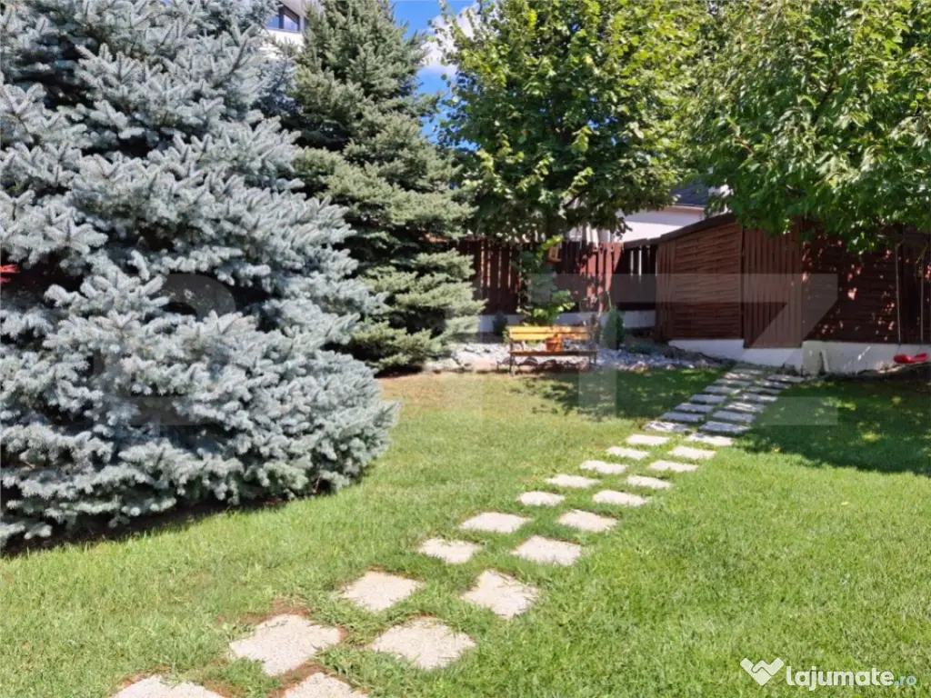 Proprietate elegantă cu teren mare și garaj în Bucium, pe