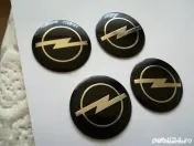 Set Capace/Embleme roți Opel diametrul 56 mm culoare pe negru