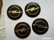 Set Capace/Embleme roți Opel diametrul 56 mm culoare pe negru