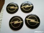 Set Capace/Embleme roți Opel diametrul 56 mm culoare pe negru