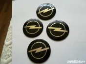 Set Capace/Embleme roți Opel diametrul 56 mm culoare pe negru
