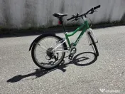 Vand bicicleta WOOM 4 (20") second-hand, verde