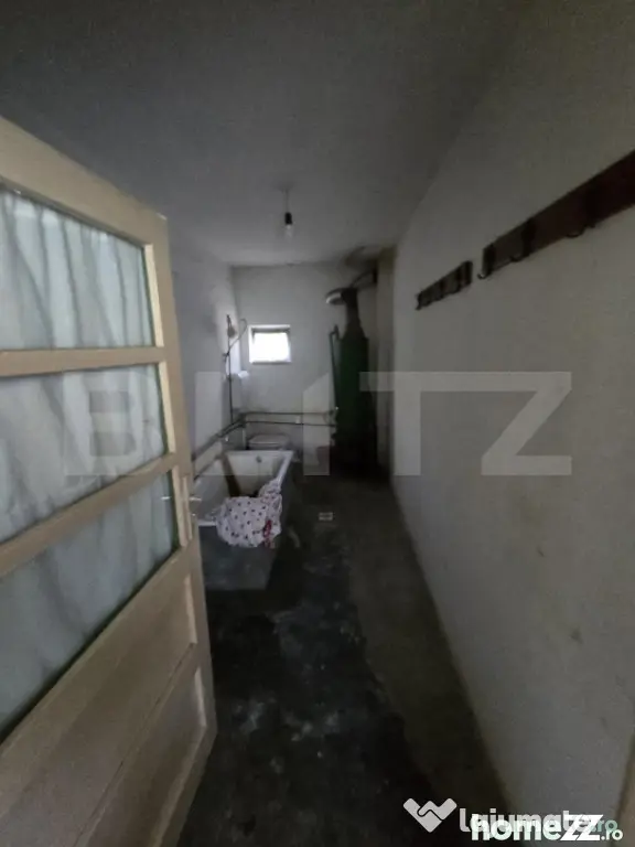 Casă 65 mp, teren de 1.500 mp, zona Titu