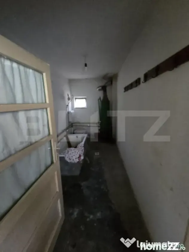 Casă 65 mp, teren de 1.500 mp, zona Titu