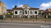 Casă cu arhitectură deosebită, 842 mp și teren de 1.048 