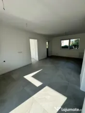 Apartament modern cu teren .Oportunitate excelentă pentru l 