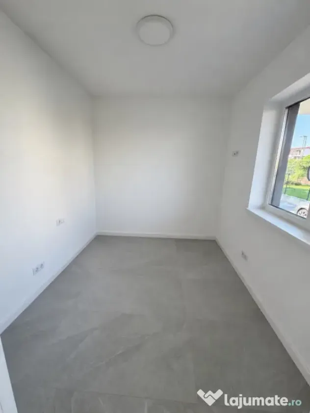 Apartament modern cu teren .Oportunitate excelentă pentru l