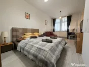 Apartament ultracentral, cu o cameră si curte comună. 