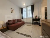 Apartament ultracentral, cu o cameră si curte comună. 