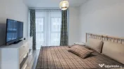 Descoperiți confortul vieții moderne într-un apartament perf 