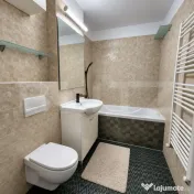 Apartament cu 3 camere, curte proprie și parcare 