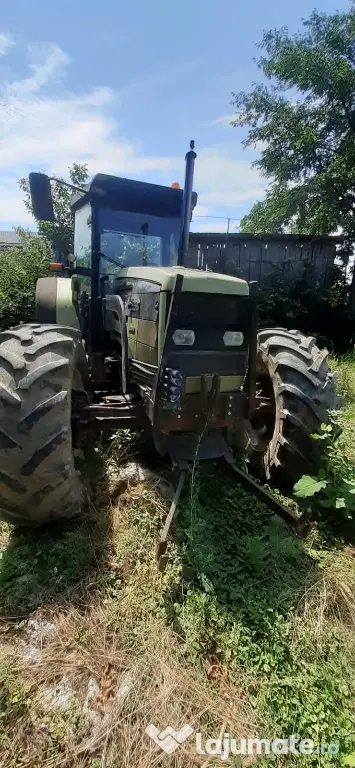 Tractor Hurlimman si plug 4 cormane reversibil