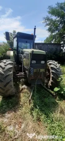 Tractor Hurlimman si plug 4 cormane reversibil